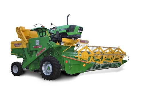 Tractor-driven harvester combine with a yellow cutter bar
