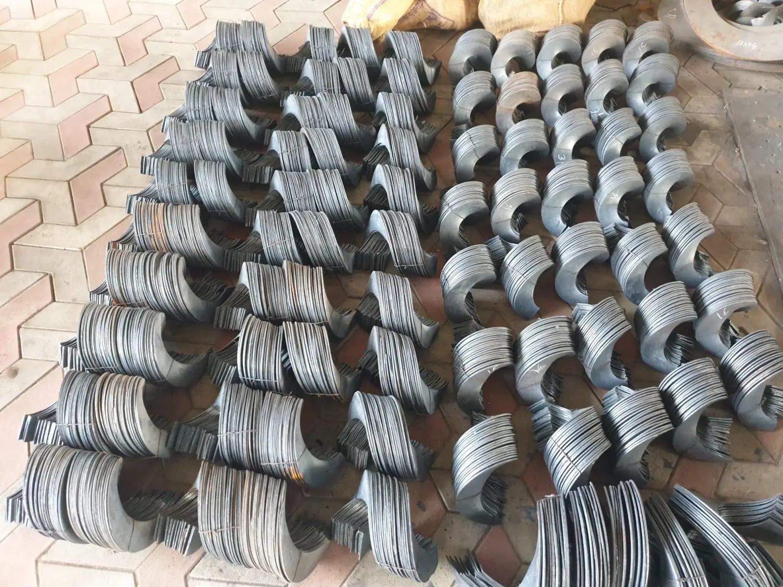 Stacks of helical auger screw flights manufactured by Jhandeana Industries