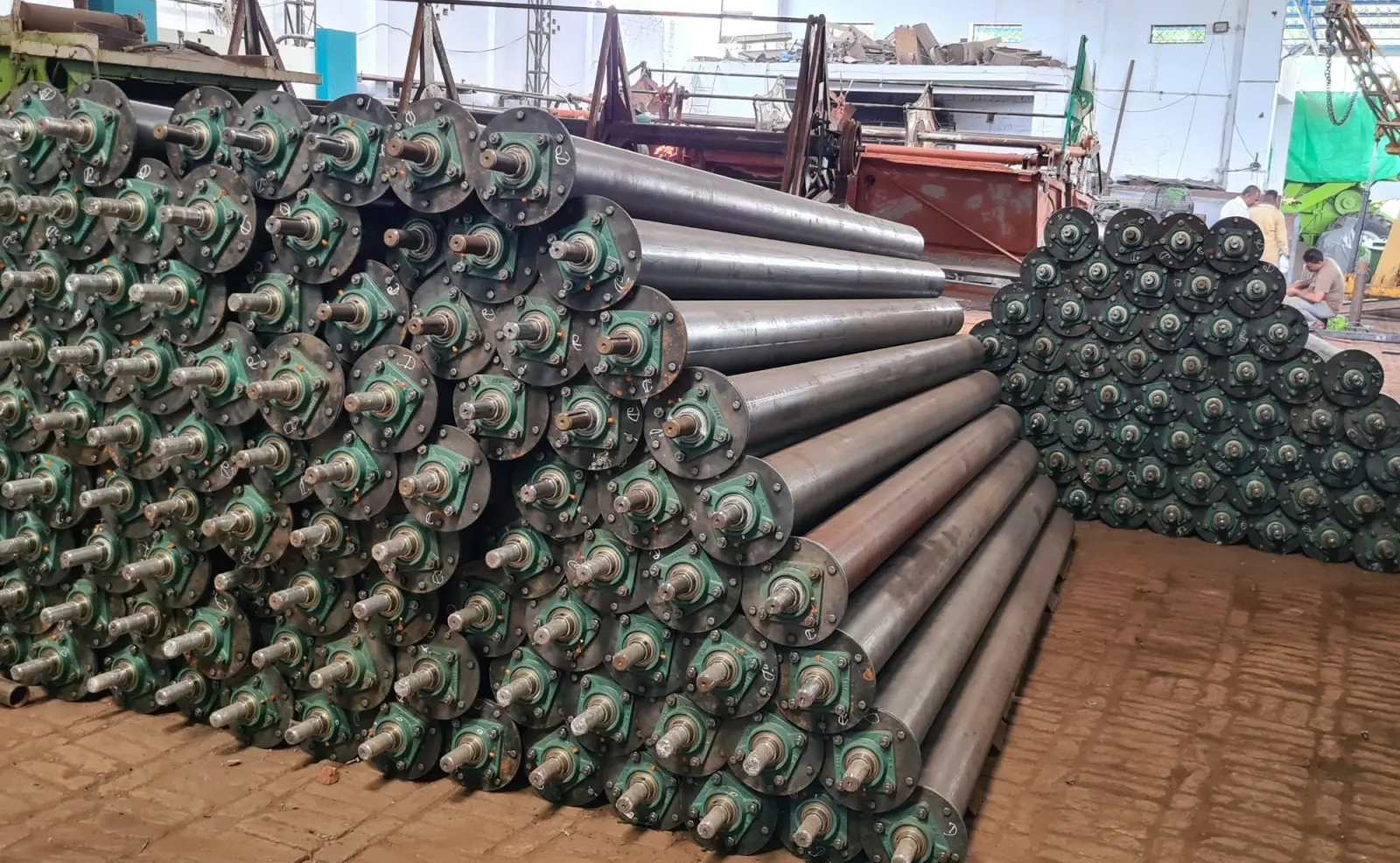 Stack of finished round screw conveyor tubes with bearing housings