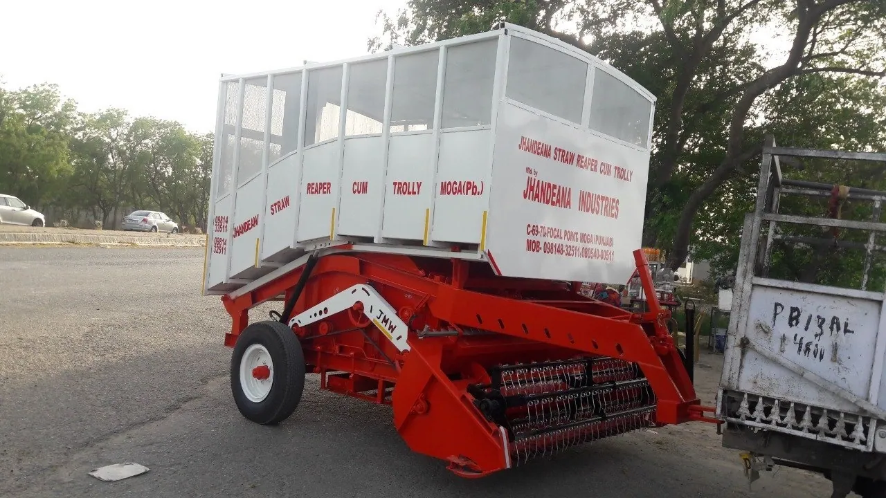 Straw reaper cum trolley manufactured by Jhandeana Industries, Moga